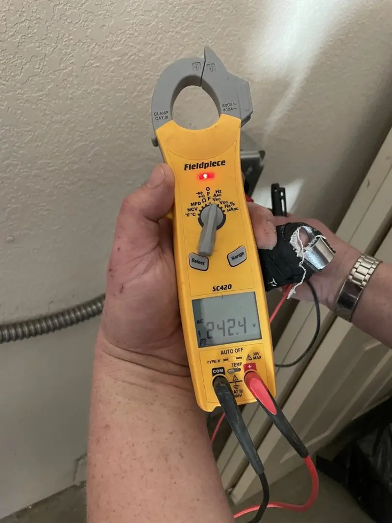 Voltage testing with clamp meter during Outlet Installation in Glen Ridge